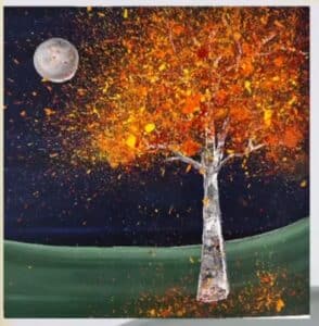 A splatter painting of a tree with vibrant autumn foliage in shades of orange, yellow, and red. The tree stands on a green hill under a night sky with a glowing full moon, with paint splatters creating a dynamic, textured effect for the leaves.